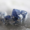 Was sind die Unterschiede zwischen den Mineralien Calcit und Quarz?